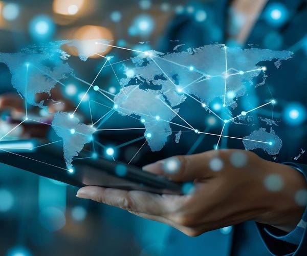 Empowering Global Connectivity Through Innovative Technology: A Businessman Engaging with a Digital World Map